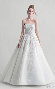 A woman wearing the Cinderella wedding gown from the 2021 Disney Fairy Tale Weddings Platinum Collection