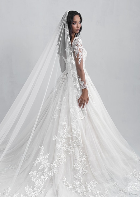 A back side view of a woman wearing the Belle wedding gown from the 2021 Disney Fairy Tale Weddings Platinum Collection