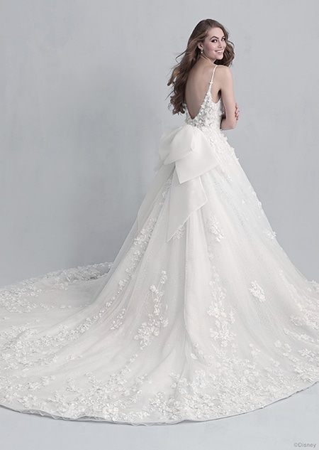 Backside view of a woman wearing the Snow White wedding gown from the 2021 Disney Fairy Tale Weddings Platinum Collection