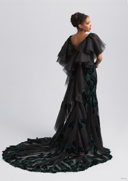 The back of a gauzy black and green wedding dress featuring a long train inspired by Maleficent from Sleeping Beauty