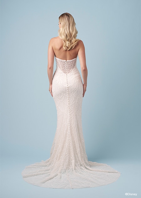 The back of a bride wearing a strapless Tiana inspired fit and flare wedding gown featuring beading