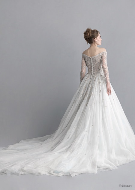 A back side view of a woman wearing the Cinderella wedding gown from the 2020 Disney Fairy Tale Weddings Platinum Collection