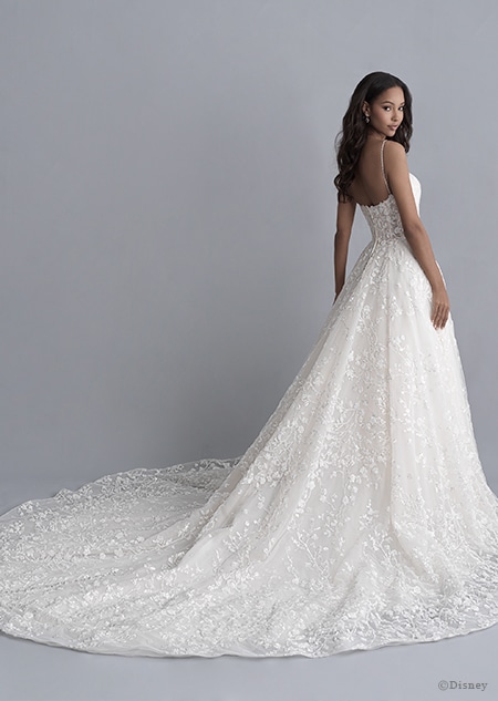 A back side view of a woman in the Tiana wedding gown from the 2020 Disney Fairy Tale Weddings Platinum Collection