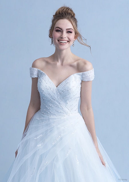 A woman in the Cinderella wedding gown from the 2021 Disney Fairy Tale Weddings Collection
