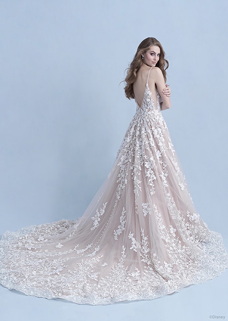 A back side view of a woman in the Snow White wedding gown from the 2021 Disney Fairy Tale Weddings A back side view of a woman in the Snow White wedding gown from the 2021 Disney Fairy Tale Weddings