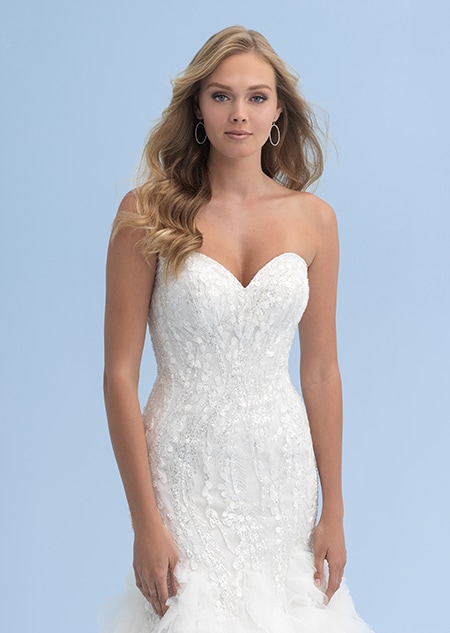 A woman in a wedding dress with a sweetheart neckline