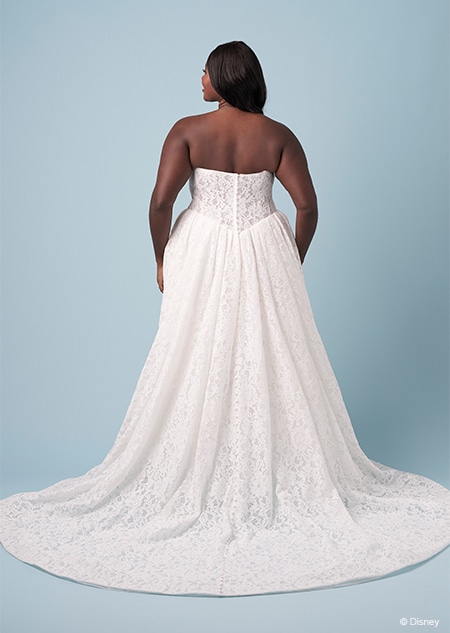 The back of a bride wearing a strapless Snow White inspired A line gown