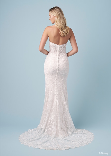 The back of a bride wearing a strapless Snow White inspired sheath dress featuring an embroidered bodice