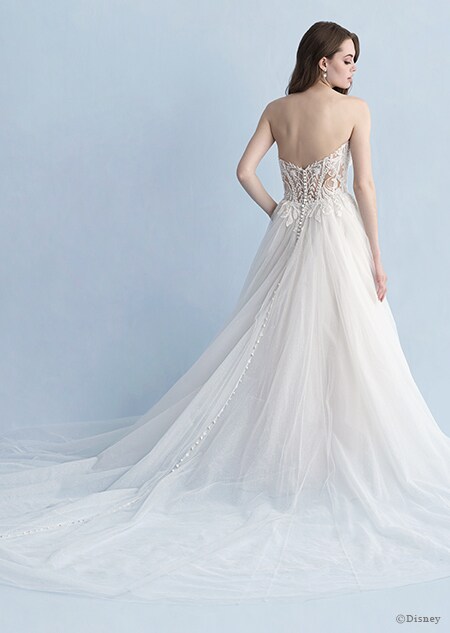 A back side view of a woman in the Aurora wedding gown from the 2020 Disney Fairy Tale Weddings Collection