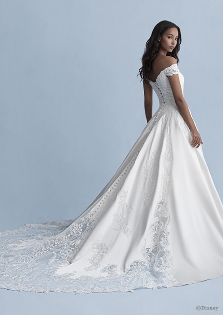 A back side view of a woman wearing the Belle wedding gown from the 2020 Disney Fairy Tale Weddings Collection