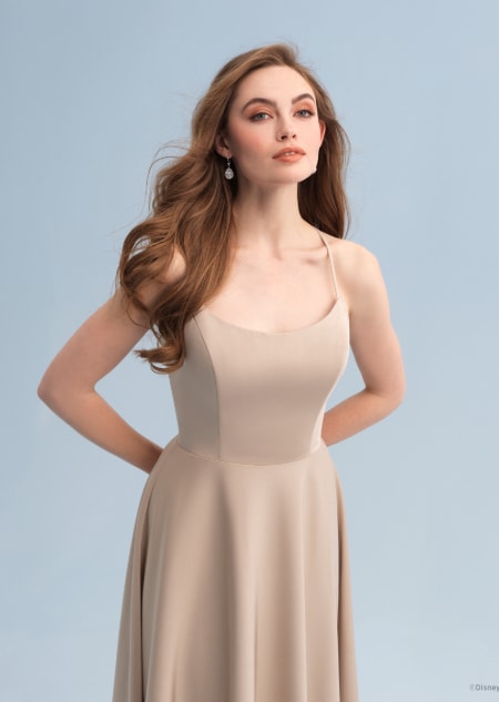 A woman wearing a Belle themed bridesmaid dress with a scoop neckline
