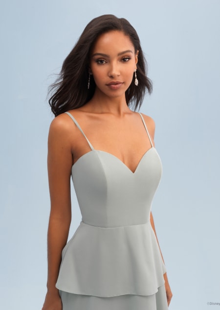 A woman wearing a Tiana themed bridesmaid dress with a sweetheart neckline with spaghetti straps