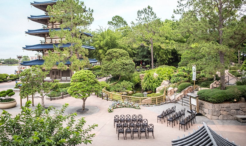 Rows of chairs set up for a wedding ceremony at the Japan Pavilion courtyard in EPCOT