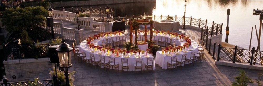 Tables arranged to make a giant circle in a courtyard next to World Showcase Lagoon