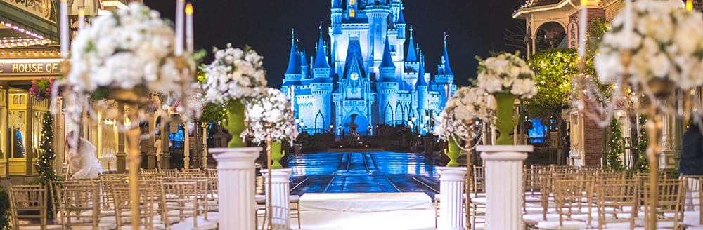 Magic Kingdom Evening Wedding Experience Disney S Fairy Tale Rows Of Chairs And Flowers Arranged For A Wedding Ceremony With Castle As The Backdrop