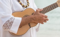 A person playing the ukulele  