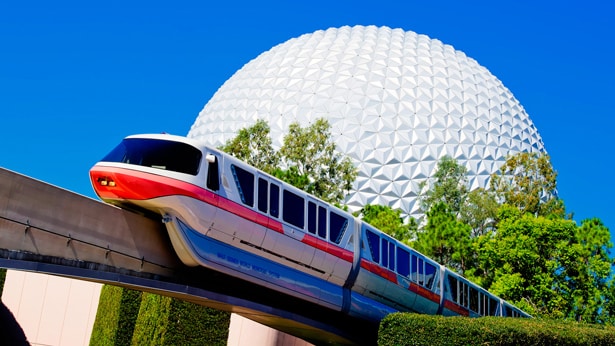 A monorail driving past Spaceship Earth at Epcot
