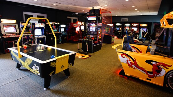 An arcade with air hockey and other games