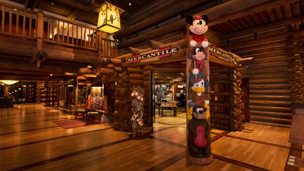 A totem pole made of Disney characters at the entrance to the Mercantile shop in the Resort lobby