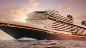 The Disney Wish Cruise with a beautiful sunset on the background