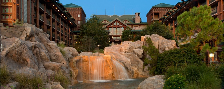The building exterior and waterfall at Disney's Wilderness Lodge in Florida