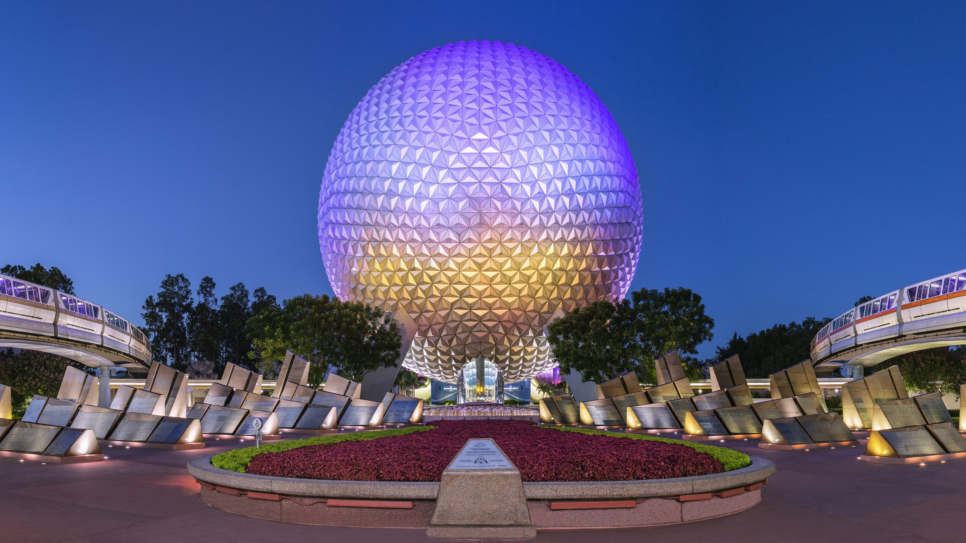 Flowers and trees at the base of Spaceship Earth at Epcot