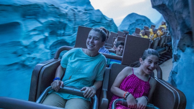 Two Guests enjoying a ride on the Expedition Everest  Legend of the Forbidden Mountain attraction at Disney's Animal Kingdom theme park