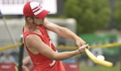A batter hitting a Wiffle ball