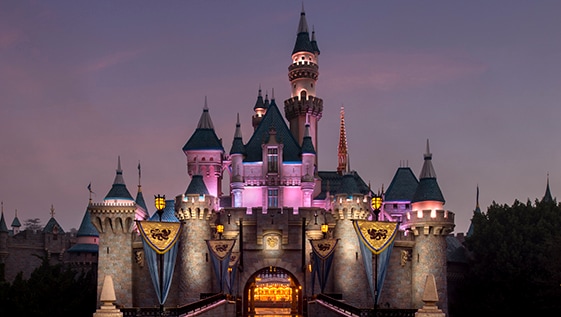 Sleeping Beauty Castle illuminated at night at Disneyland Park