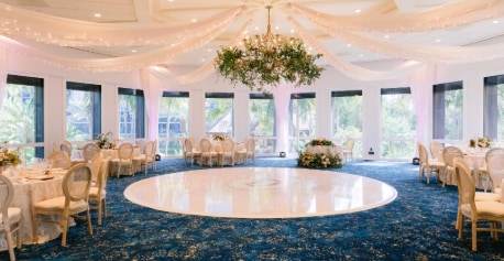 Sleeping Beauty Pavillion with set tables, floral arrangements and a decorated chandelier
