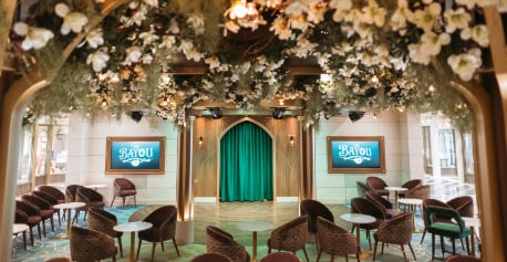 The Bayou lounge on the Disney Wish featuring a canopy of magnolia blossoms